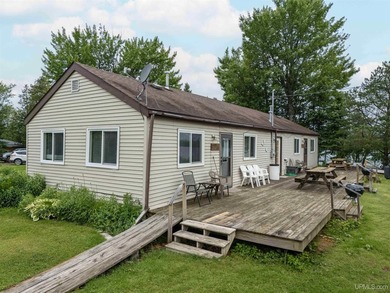 This charming four-unit resort on Lake Emily boasts 2,276 square - photo 5