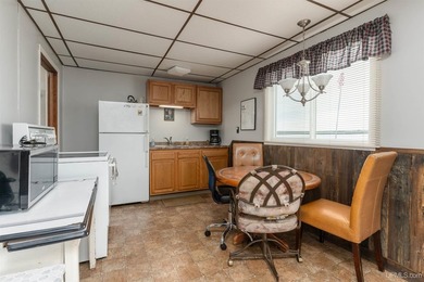 This charming four-unit resort on Lake Emily boasts 2,276 square - photo 9