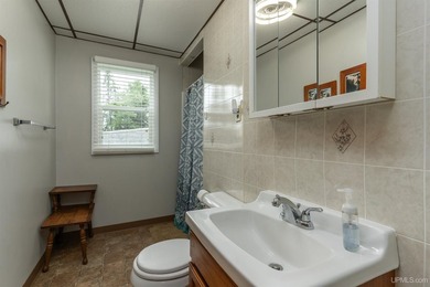This charming four-unit resort on Lake Emily boasts 2,276 square - photo 10
