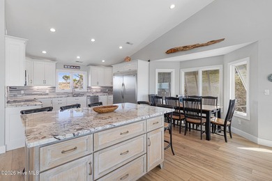 This oceanfront 4-bedroom plus flex, 4.5-bath, home sits on a - photo 19