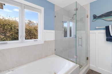 This oceanfront 4-bedroom plus flex, 4.5-bath, home sits on a - photo 32