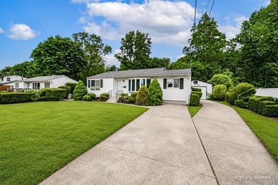 Set on an impressive 75' x 220' property in Bay Shore, this - photo 2