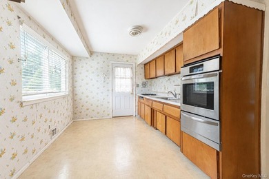 Set on an impressive 75' x 220' property in Bay Shore, this - photo 8
