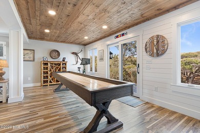 This oceanfront 4-bedroom plus flex, 4.5-bath, home sits on a - photo 40