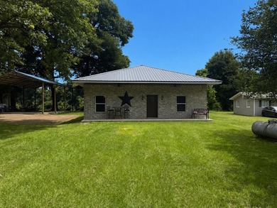 Enjoy riverfront living at its best in this completely renovated - photo 1