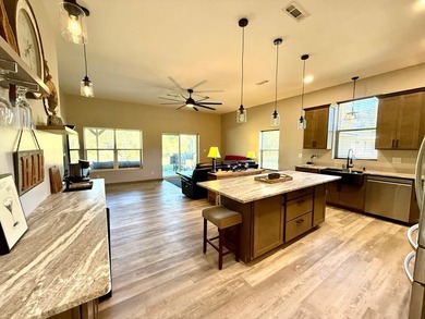 Enjoy riverfront living at its best in this completely renovated - photo 4