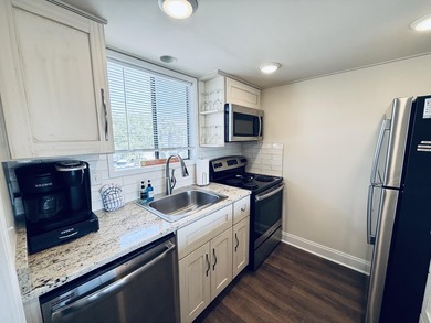 Welcome to this beautifully updated 1-bedroom & rare 1.5-bath - photo 12