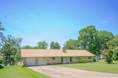 Welcome to this charming ranch-style brick home nestled on a - photo 2