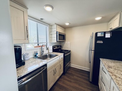 Welcome to this beautifully updated 1-bedroom & rare 1.5-bath - photo 13