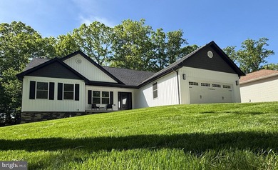 Nestled in the prestigious Lake of the Woods community, this - photo 3