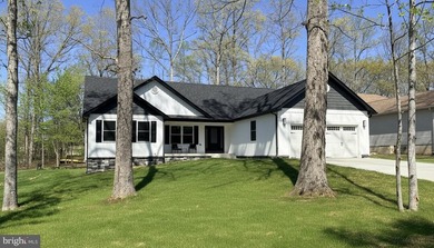 Nestled in the prestigious Lake of the Woods community, this - photo 5