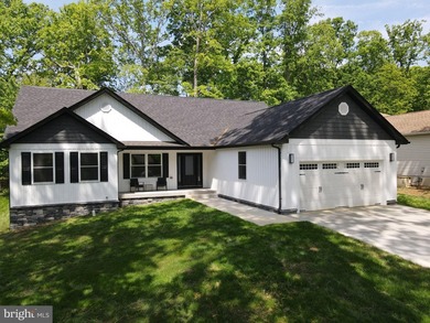 Nestled in the prestigious Lake of the Woods community, this - photo 6