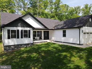 Nestled in the prestigious Lake of the Woods community, this - photo 7