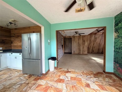 Tucked away on 7.6+ acres of unrestricted, lakefront land on - photo 4