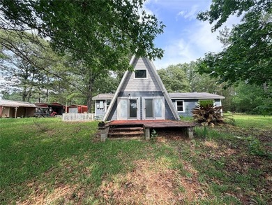 Tucked away on 7.6+ acres of unrestricted, lakefront land on - photo 5