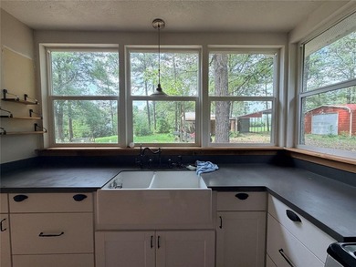 Tucked away on 7.6+ acres of unrestricted, lakefront land on - photo 6