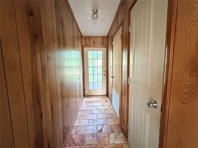 Tucked away on 7.6+ acres of unrestricted, lakefront land on - photo 7