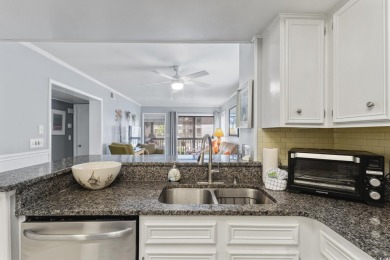 This beautifully updated, rarely available, corner unit, located