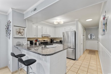 This beautifully updated, rarely available, corner unit, located