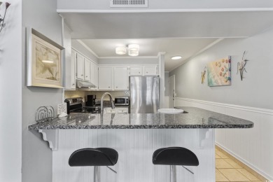 This beautifully updated, rarely available, corner unit, located