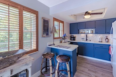 Beautifully updated 2BD/2BA corner residence featuring impact - photo 6