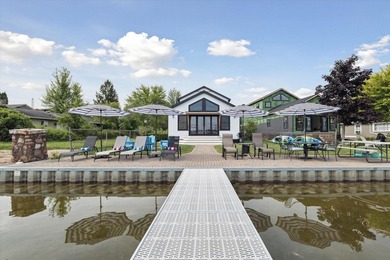 Brand new, turn-key luxury on Portage Lake. Wake up to - photo 1