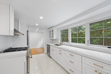 Welcome to this beautifully renovated Tudor, ideally located in - photo 18