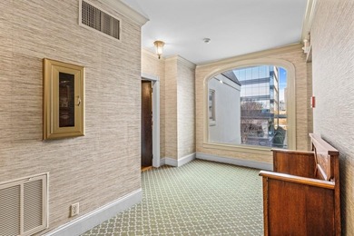 Desirable one-level living awaits in the admired Evian building