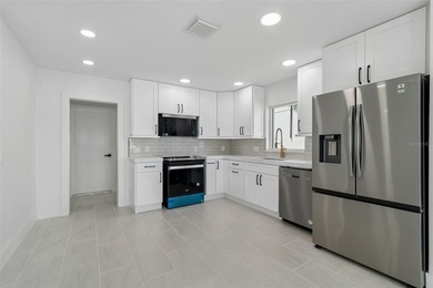 Price Improvement! Experience the pinnacle of refined waterfront - photo 11