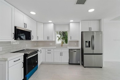 Price Improvement! Experience the pinnacle of refined waterfront - photo 12