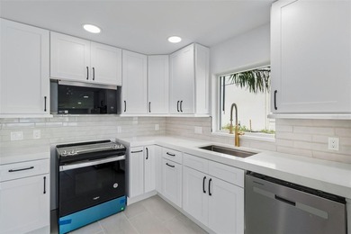 Price Improvement! Experience the pinnacle of refined waterfront - photo 13