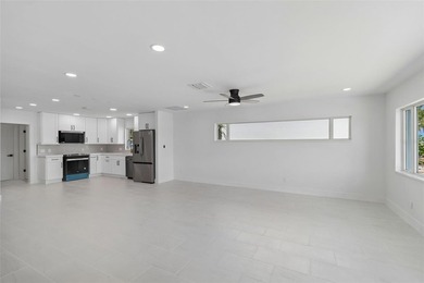 Price Improvement! Experience the pinnacle of refined waterfront - photo 21