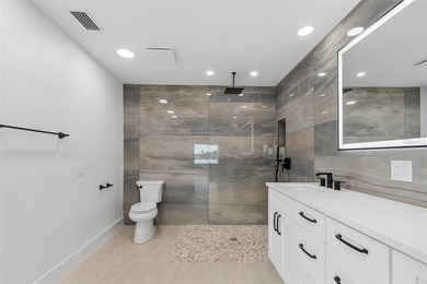 Price Improvement! Experience the pinnacle of refined waterfront - photo 27