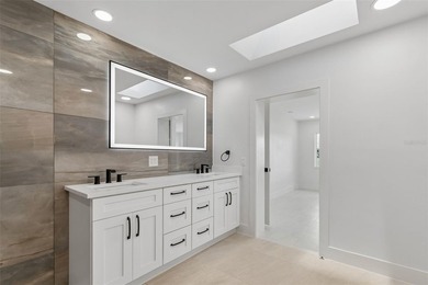 Price Improvement! Experience the pinnacle of refined waterfront - photo 28