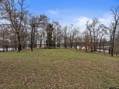 Discover the perfect waterfront retreat with this 1.09 +/- acre - photo 3