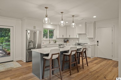 This beautifully renovated waterfront home blends modern - photo 4