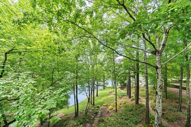 Welcome to a waterfront sanctuary nestled among the trees in the - photo 45