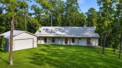 This extraordinary property, INCLUDING BOAT nestled within the - photo 1
