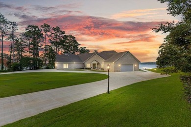 There are lake homes, and then there's this one. Sitting on a - photo 1
