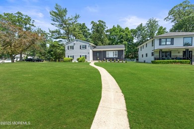 Nestled in the heart of prestigious Deal Park, this exceptional - photo 3