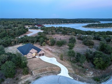 Custom home tucked away in beautiful Northstar Pointe. Built in - Lake Home For Sale in Chico, Texas