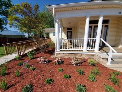 This remarkable cottage style property sits right on heavily - photo 22