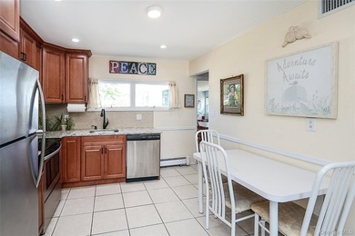 Welcome home to this spacious 6-bedroom, 2-bath Colonial nestled - photo 4