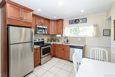 Welcome home to this spacious 6-bedroom, 2-bath Colonial nestled - photo 5