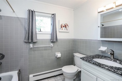 Welcome home to this spacious 6-bedroom, 2-bath Colonial nestled - photo 9