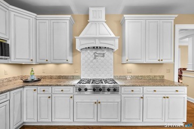 Beautifully rebuilt in 2006, this custom turn-key retreat offers - photo 14