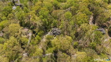 Beautifully rebuilt in 2006, this custom turn-key retreat offers - photo 34