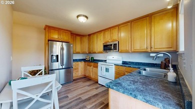 Three bedrooms and a spacious two-level layout set the tone for - photo 11
