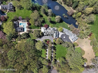 Beyond private gates, a tree-lined drive reveals Turtle Pond - photo 4