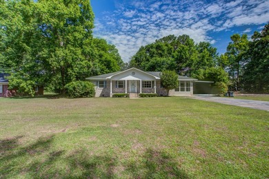 Welcome to this charming 3-bedroom brick ranch nestled on a - photo 1